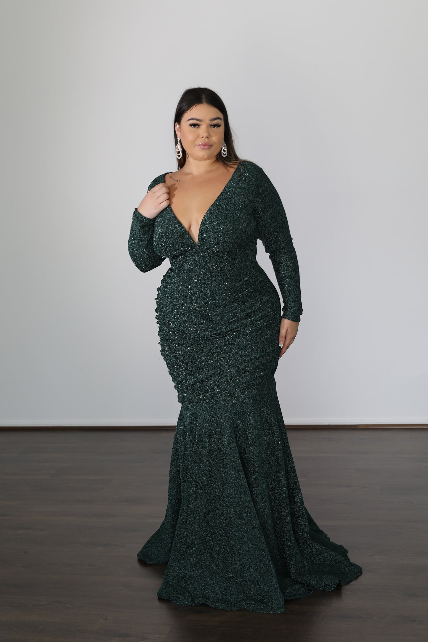 emerald green mermaid formal gown with low neckline