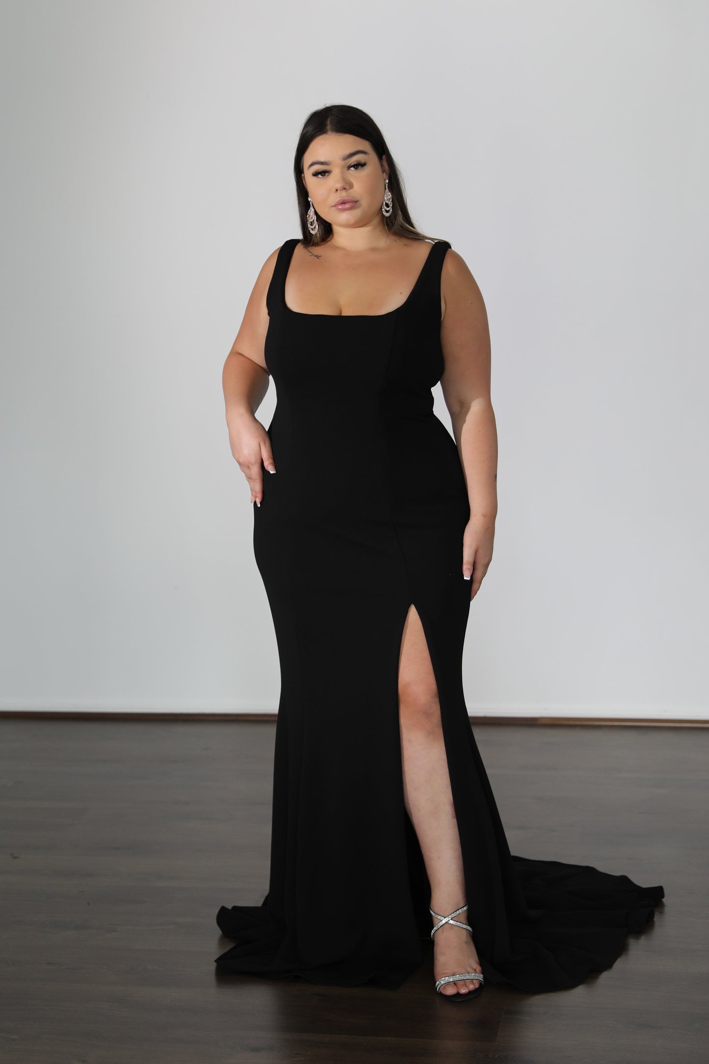 fitted black formal gown with u-neckline and thick straps