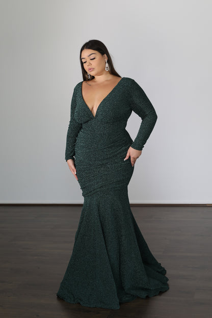 green long sleeved formal gown with low cut top and mermaid skirt