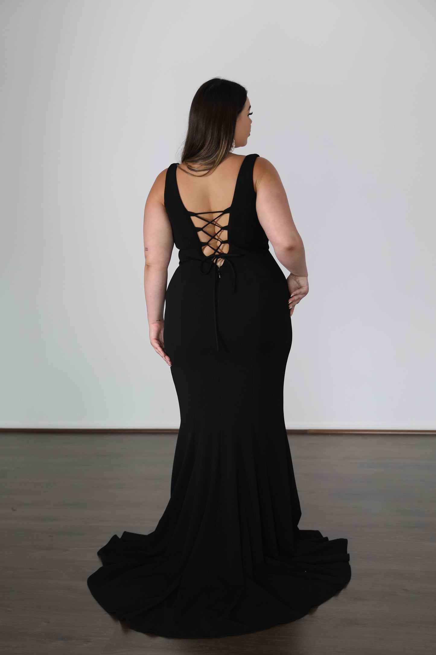 lace tie up back on fitted black dress