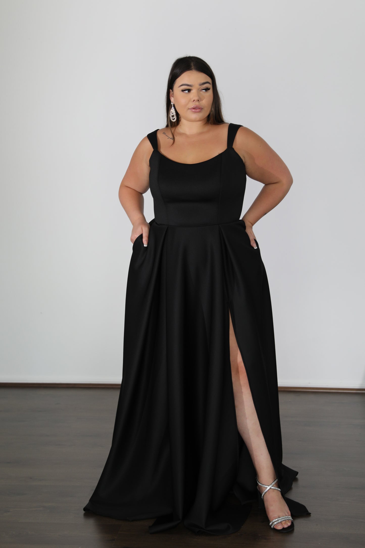 plus size flowing black formal dress with thigh split and sweetheart neckline