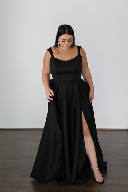 plus size model wearing black formal gown