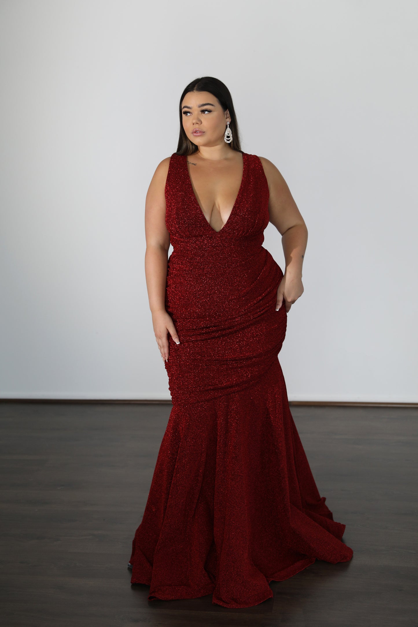 red mermaid style formal dress with centre ruching and v-neck