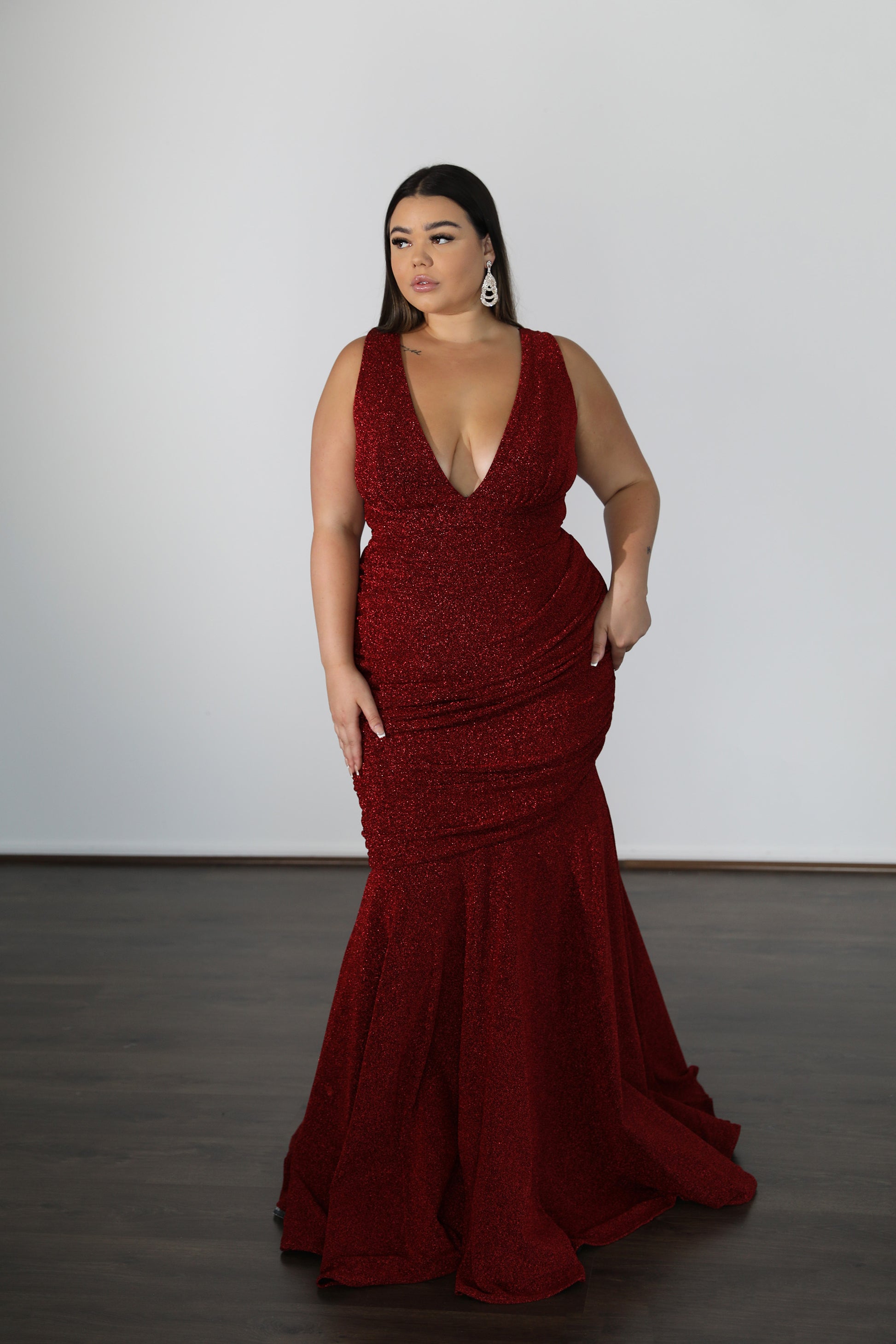 red mermaid style formal dress with centre ruching and v-neck